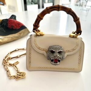 Authentic   Gucci calfskin crystal mini Thiara top handle bag.